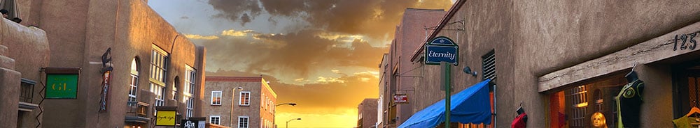 a view of a sante fe, NM street with a sunset